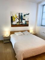 Posteľ alebo postele v izbe v ubytovaní Place de la Mairie, Art Apparts