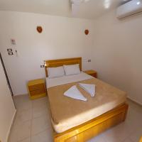 A bed or beds in a room at Nile Sunrise Flats