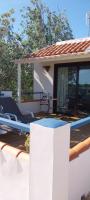 a wooden deck with a swimming pool on a house at Paraiso Perdido in Conil de la Frontera