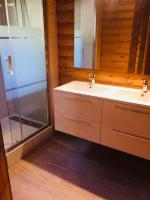 a bathroom with a sink and a glass shower at El Chalet du Père Castor in Bolquere Pyrenees 2000