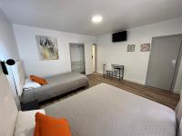 Posteľ alebo postele v izbe v ubytovaní Hostal ARS