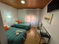 Posteľ alebo postele v izbe v ubytovaní Hostal ARS