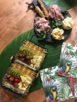 a table with two baskets of food on a table at Péniche Match in Arles