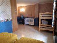 a bedroom with two bunk beds and a desk at Magnifiques maisons de campagne au sein d&#39;un vignoble in Cazouls-lès-Béziers