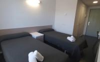 Postel nebo postele na pokoji v ubytování Residencia Universitaria Resa Roberto de Nobili