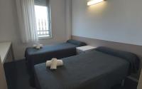 Postel nebo postele na pokoji v ubytování Residencia Universitaria Resa Roberto de Nobili