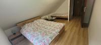 Posteľ alebo postele v izbe v ubytovaní Apartament Zacisze
