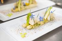 a white plate with some food on a table at Château De Noirieux in Briollay