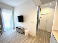 TV a/nebo společenská místnost v ubytování Apartamentos Hotel Puente de Hierro