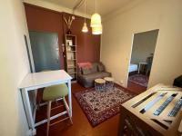 Posedenie v ubytovaní SERENITE - Appartement climatisé au calme - WIFI