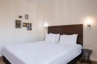 Llit o llits en una habitaci&oacute; de H&ocirc;tel Istria by Magna Arbor