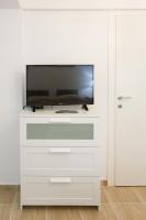Televízia a/alebo spoločenská miestnosť v ubytovaní Breeze apartment