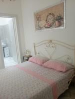 A bed or beds in a room at B&B Lo Scrigno del Salento
