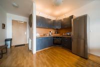 A kitchen or kitchenette at Comfy condo on the 20th floor & FREE parking