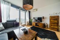 A television and/or entertainment centre at Comfy condo on the 20th floor & FREE parking