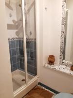 a shower with a glass door in a bathroom at Magnifique maison de campagne au cœur d&#39;un domaine viticole in Cazouls-lès-Béziers