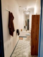 a bathroom with a toilet and a sink and a tub at Magnifique maison de campagne au cœur d&#39;un domaine viticole in Cazouls-lès-Béziers