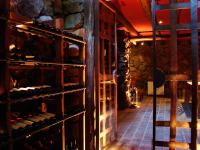 a wine cellar with a bunch of wine bottles at Lares De Chacras in Chacras de Coria