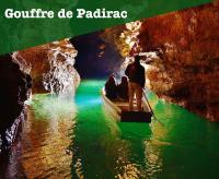 a man riding a boat under a bridge in a cave at Gambetta 304 CahorsCityStay in Cahors