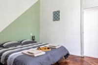 a bedroom with a bed with towels on it at Gambetta 304 CahorsCityStay in Cahors