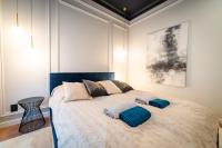 Posteľ alebo postele v izbe v ubytovaní Lake Park Apartament