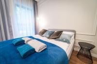 Posteľ alebo postele v izbe v ubytovaní Lake Park Apartament