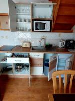 A kitchen or kitchenette at Apartmán Tatralandia 336