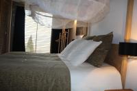 A bed or beds in a room at Loft Rural Cirueches 19