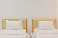 Postel nebo postele na pokoji v ubytování S1 Trang Hotel