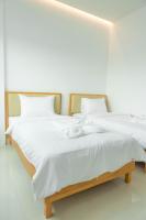 Postel nebo postele na pokoji v ubytování S1 Trang Hotel