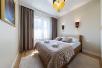 Łóżko lub łóżka w pokoju w obiekcie Apartament Luxury Two-bedroom