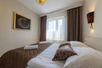Łóżko lub łóżka w pokoju w obiekcie Apartament Luxury Two-bedroom