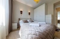 Łóżko lub łóżka w pokoju w obiekcie Apartament Luxury Two-bedroom