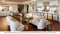 a lobby with a couch and chairs and a counter at Jumeirah Mina Al Salam Dubai in Dubai