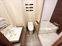 a bathroom with a sink and a toilet and a shower at HOTEL SUI AKASAKA by ABEST in Tokyo