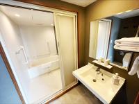 a bathroom with a tub and a sink and a shower at HOTEL SUI AKASAKA by ABEST in Tokyo