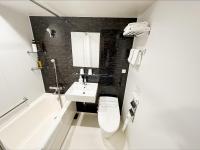 a bathroom with a toilet and a sink and a bath tub at HOTEL SUI AKASAKA by ABEST in Tokyo