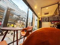 a restaurant with a table and chairs and a window at HOTEL SUI AKASAKA by ABEST in Tokyo