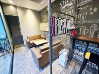 a restaurant with a couch and a bar with a sign at HOTEL SUI AKASAKA by ABEST in Tokyo