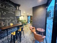a bar in a restaurant with chairs and tables at HOTEL SUI AKASAKA by ABEST in Tokyo