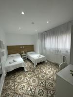 Postel nebo postele na pokoji v ubytování Hostal Nova Barcelona