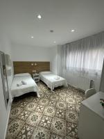 Postel nebo postele na pokoji v ubytování Hostal Nova Barcelona