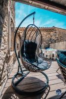 Część wypoczynkowa w obiekcie Maison de village cosy avec terrasse privée
