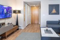 Televízia a/alebo spoločenská miestnosť v ubytovaní Nogalera Soul, City Center Apartment BY NAMASTE ELITE