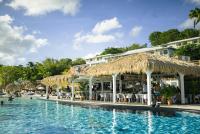 a resort with a swimming pool and a hotel at Un petit joyau 215 in Le Diamant