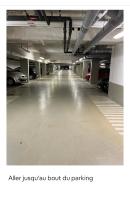 an empty parking garage with cars parked in it at Superbe Appart 2P pour 4 pers à 5 min TGV RER Orly in Massy