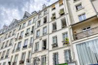 a large white building with lots of windows and balconies at New and Designed Studio well Equipped - Heart of Paris 2 in Paris