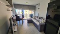 Televízia a/alebo spoločenská miestnosť v ubytovaní Apartamento Acacias IV 5 IF Benidorm
