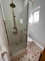 a bathroom with a shower and a toilet at Paris Home in Boulogne-Billancourt