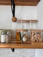 a wooden shelf with jars and other items on it at Paris Home in Boulogne-Billancourt